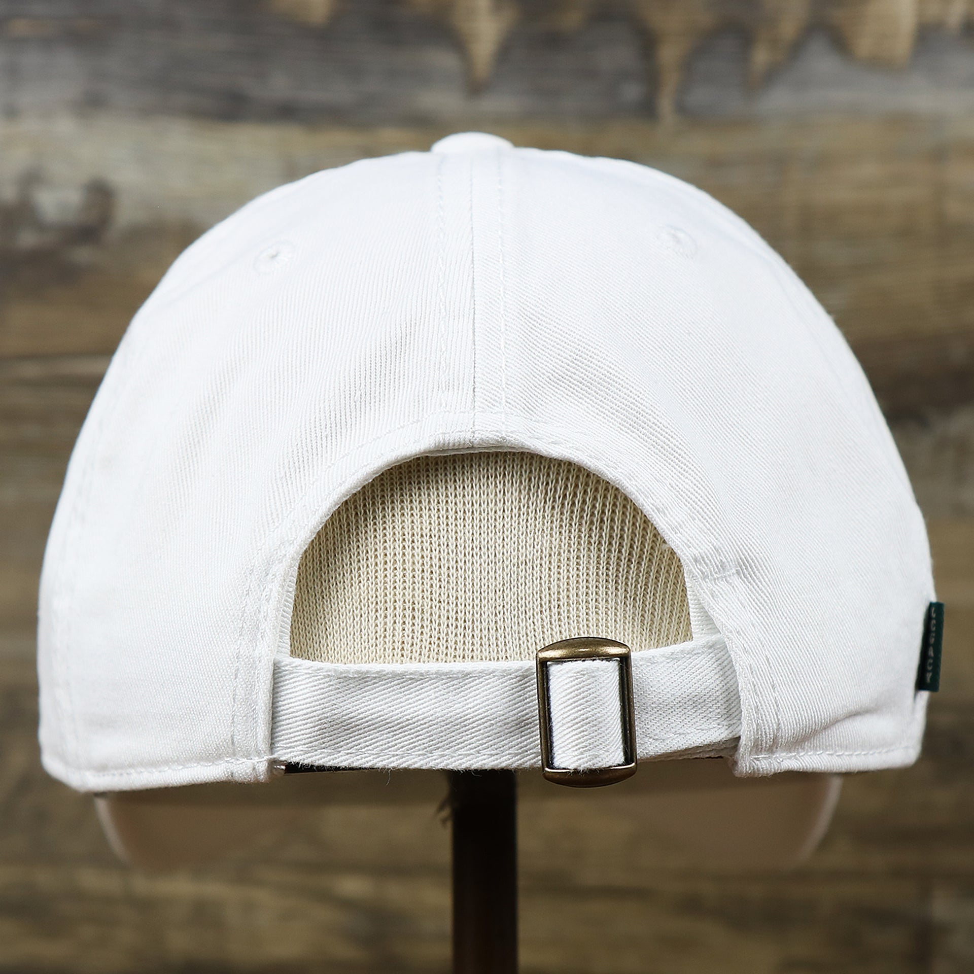 The backside of the Light Blue OCNJ Wordmark Pink Outline Dad Hat | White Dad Hat
