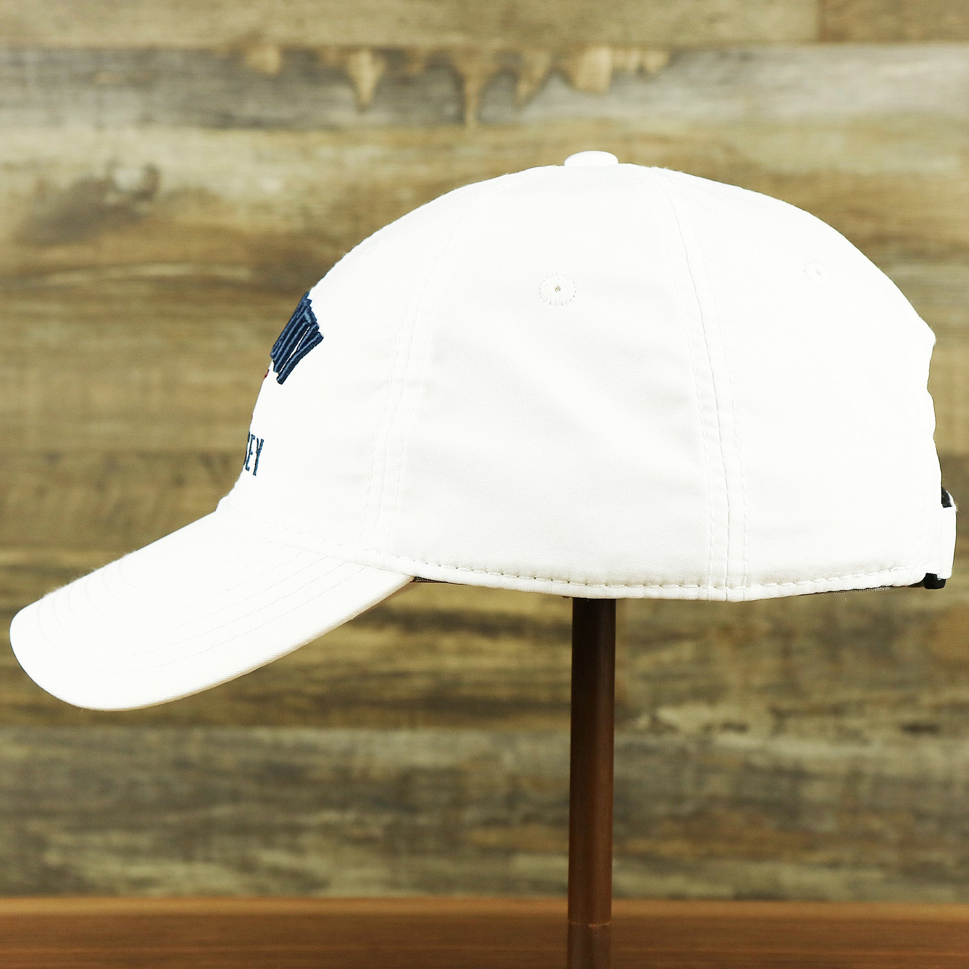 The wearer's left of the Ocean City New Jersey Wordmark Crossed Oars Logo Dad Hat | White Dad Hat