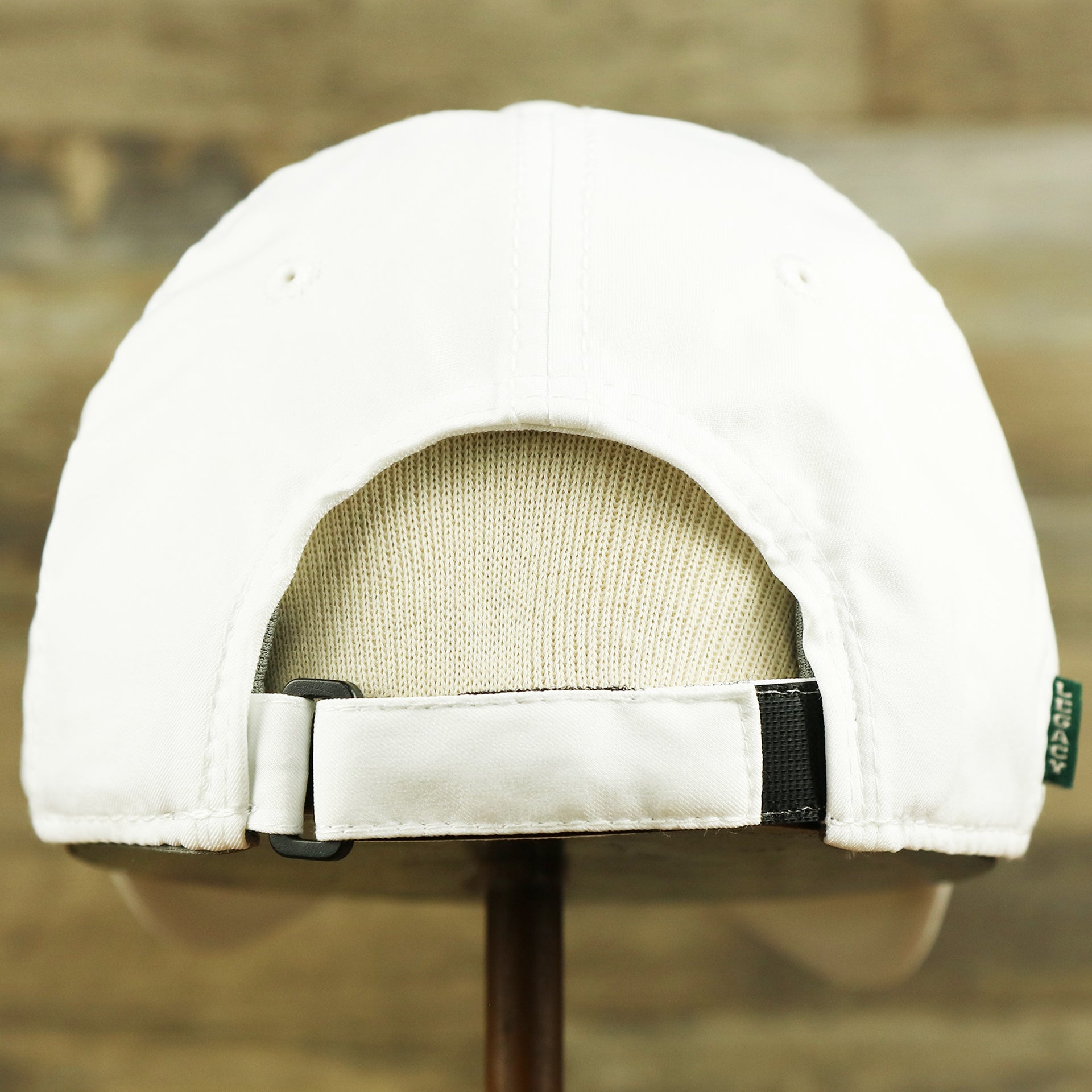 The backside of the Ocean City New Jersey Wordmark Crossed Oars Logo Dad Hat | White Dad Hat