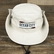 The Ocean City Wordmark Parallel Oars New Jersey Bucket Hat | Stone Bucket Hat with sides pinned up on the Ocean City Wordmark Parallel Oars New Jersey Bucket Hat | Stone Bucket Hat
