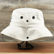 The wearer's left on the Ocean City Wordmark Parallel Oars New Jersey Bucket Hat | Stone Bucket Hat