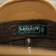 The Legacy Tag on the Ocean City Leather Tuna Patch New Jersey Mesh Back Trucker Hat | Marine Blue Mesh Trucker Hat