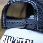 The Navy Adjustable Strap on the OCNJ Block Ocean City Wordmark Mesh Trucker Hat | Light Blue Trucker Hat