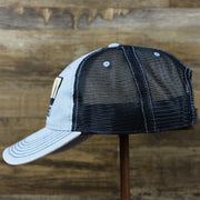 The wearer's left on the OCNJ Block Ocean City Wordmark Mesh Trucker Hat | Light Blue Trucker Hat