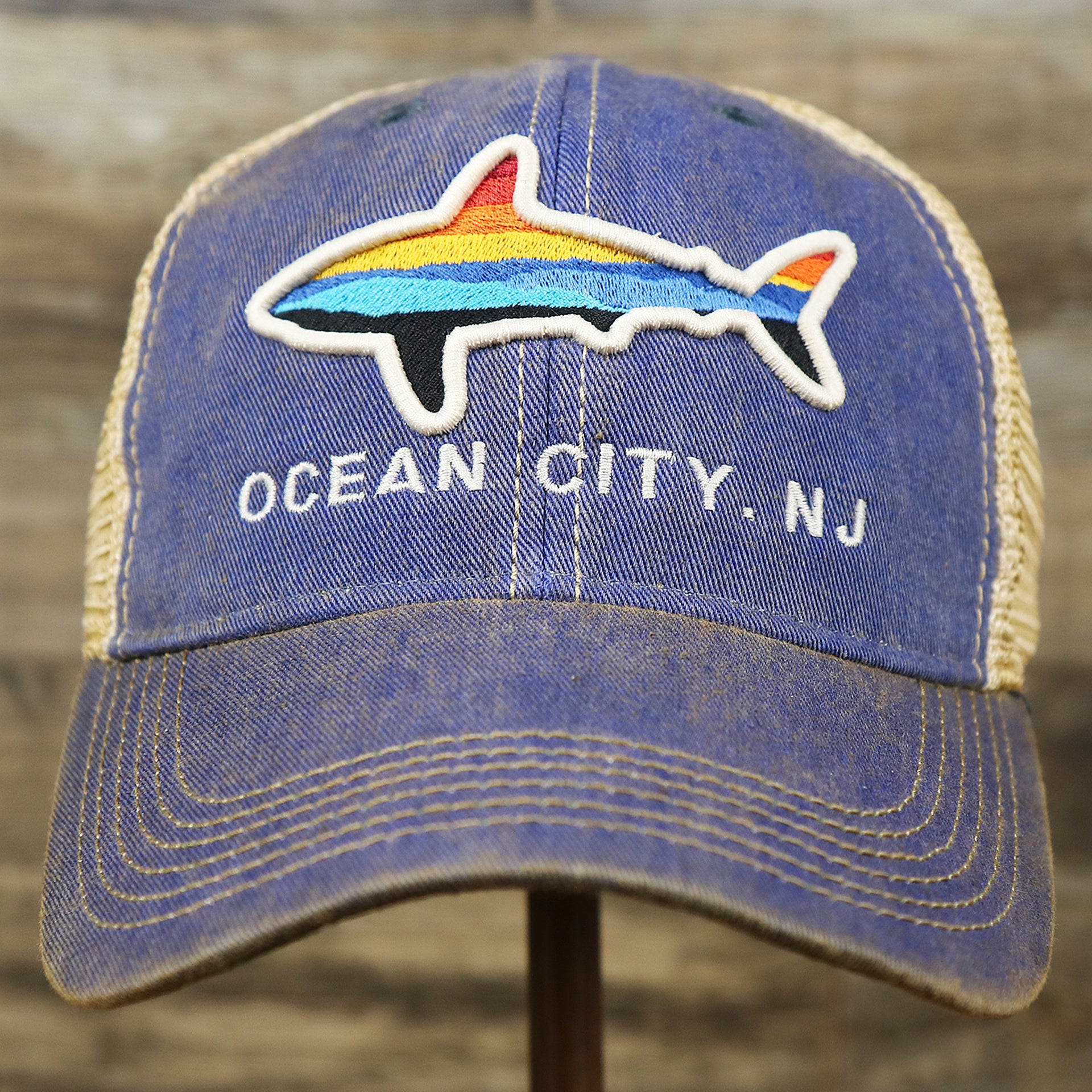 The front of the Ocean City Horizon Shark Vintage Mesh Back Worn Colorway Trucker Hat | Blue Trucker Hat