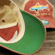 The undervisor on the Youth Ocean City Horizon Shark Vintage Mesh Back Worn Colorway Trucker Hat | Cardinal Trucker Hat