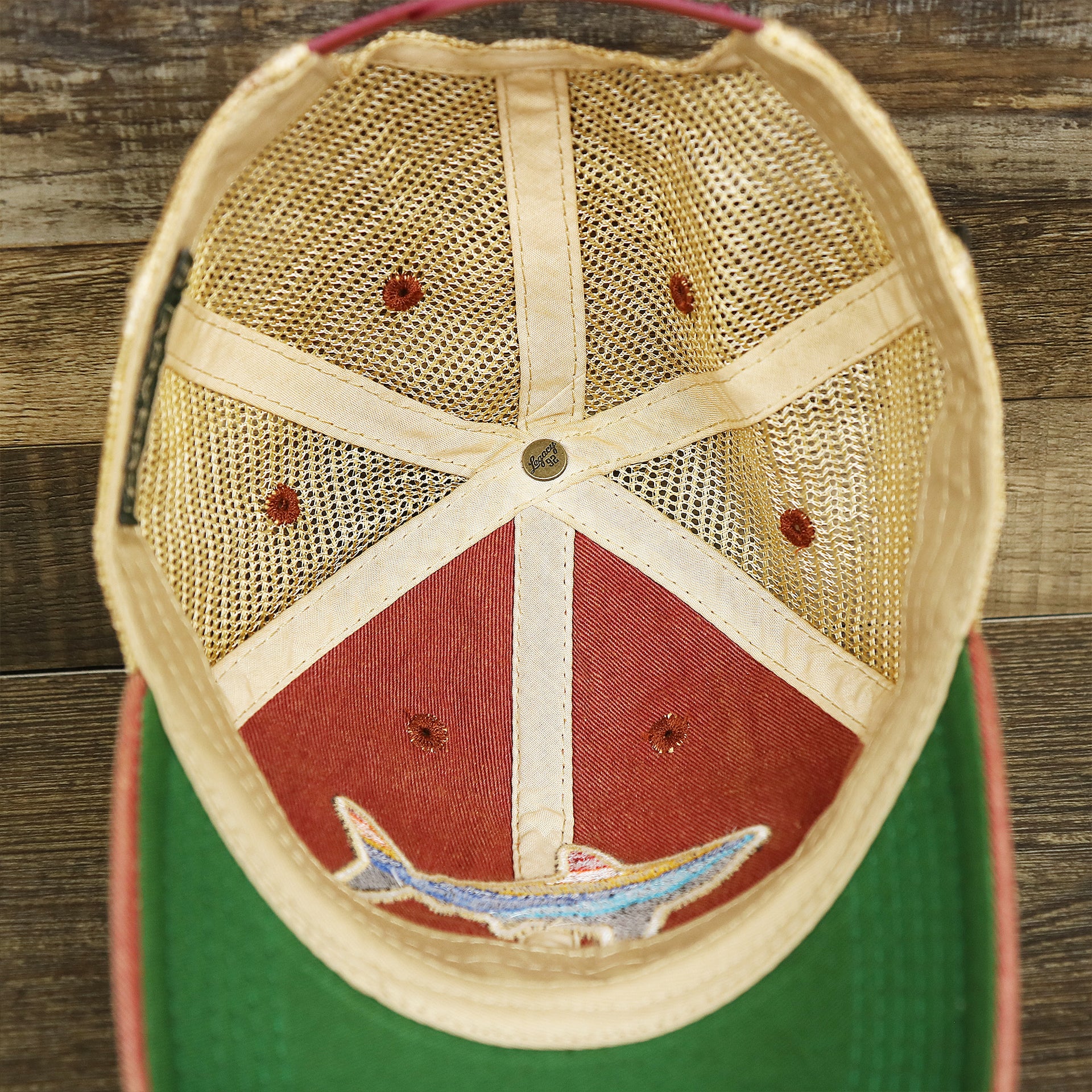 The inside of the Ocean City Horizon Shark Vintage Mesh Back Worn Colorway Trucker Hat | Cardinal Trucker Hat