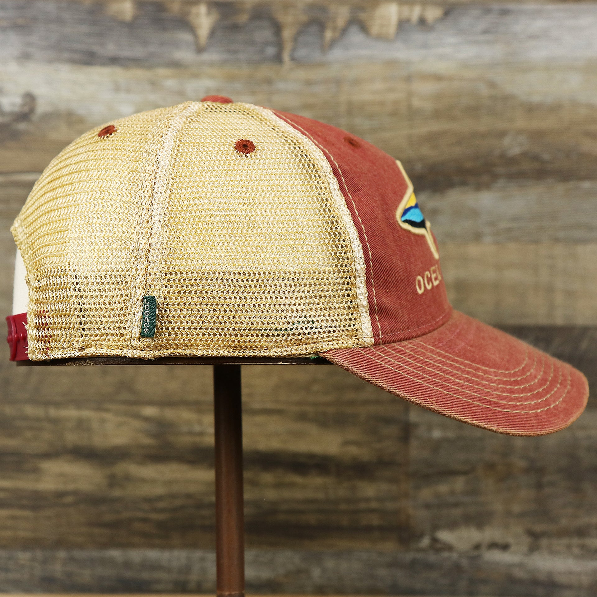 The wearer's right on the Youth Ocean City Horizon Shark Vintage Mesh Back Worn Colorway Trucker Hat | Cardinal Trucker Hat