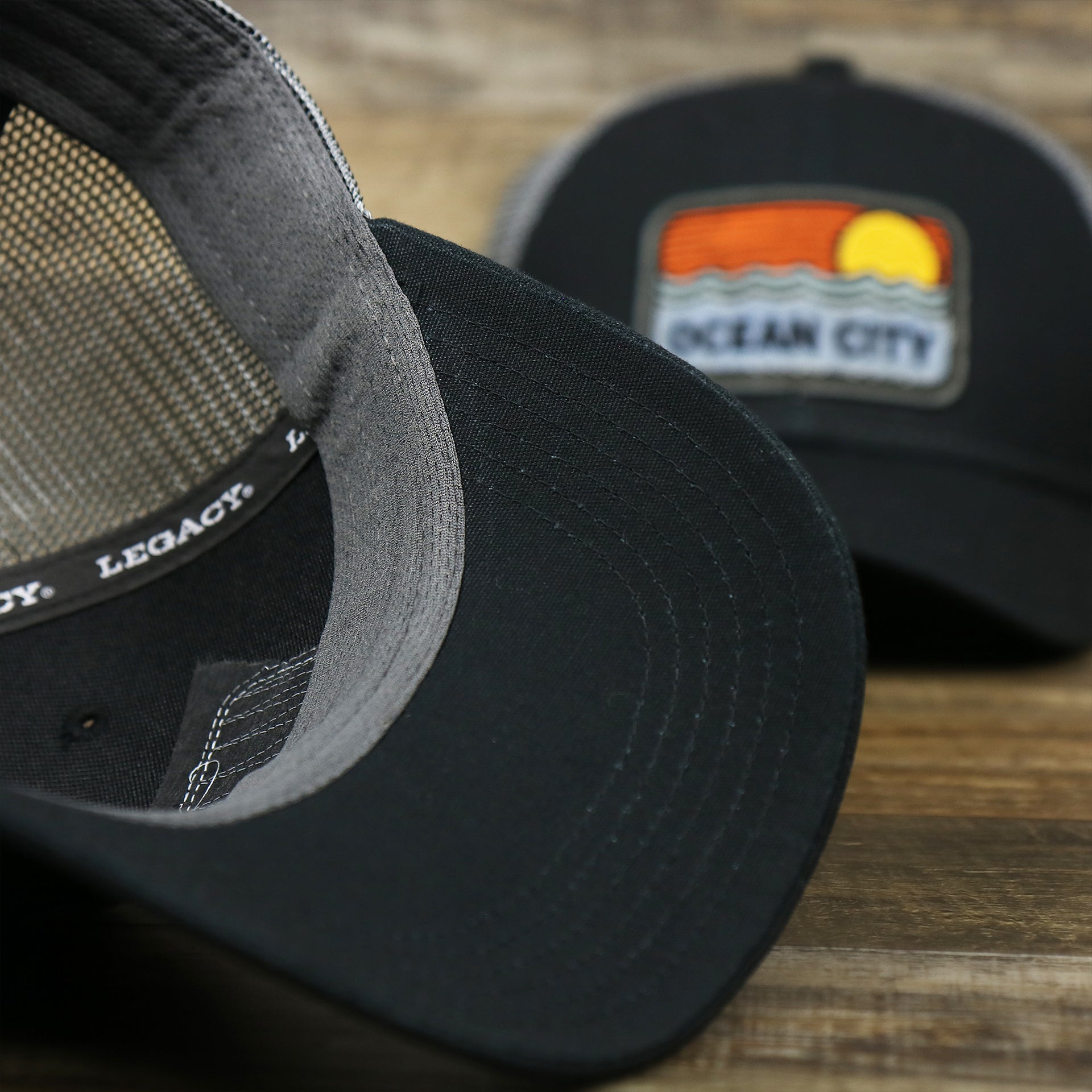 The undervisor on the Youth New Jersey Ocean City Sunset Mesh Back Trucker Hat | Tahiti Blue And Grey Mesh Trucker Hat