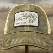 The front of the Ocean City New Jersey Since 1897 Helm Patch Camo Print Mesh Back Trucker Hat | Camo Green Trucker Hat