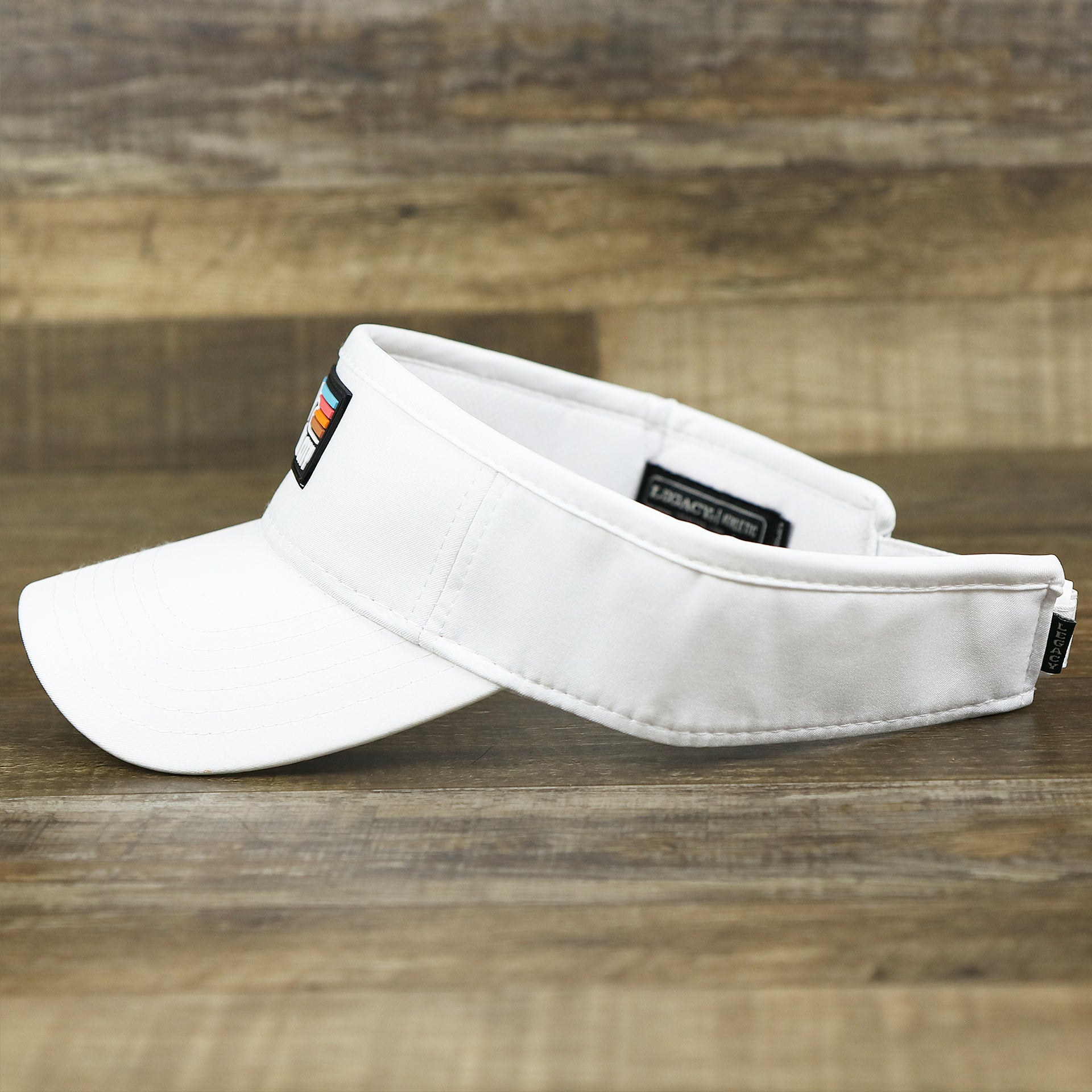 The wearer's left on the New Jersey High Point PVC Ocean City Rubber Patch Cool Fit Adjustable Visor | White Visor
