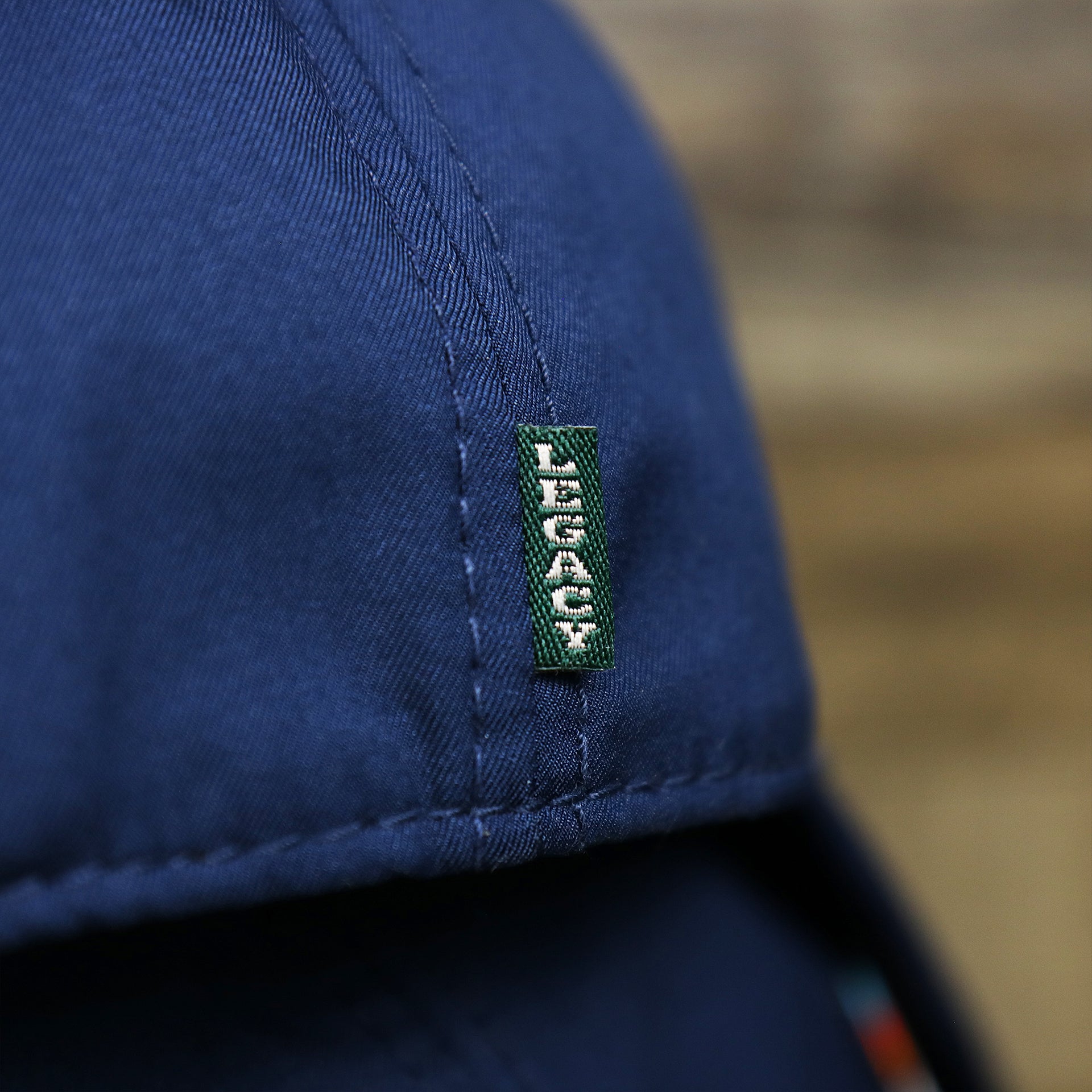 The Green legacy Tag on the New Jersey High Point PVC Ocean City Rubber Patch Cool Fit Adjustable Dad Hat | Navy Blue Dad Hat