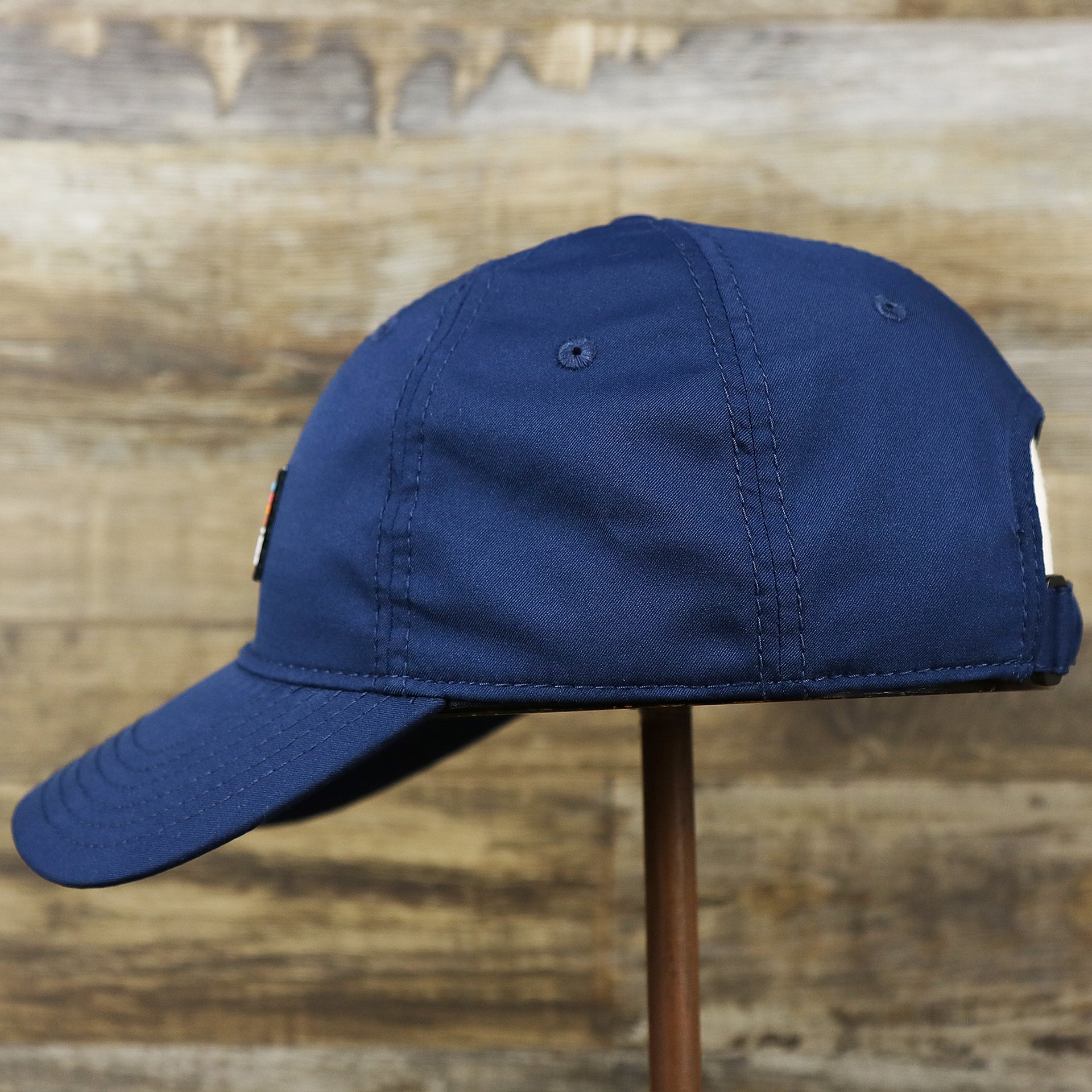 The wearer's left of the New Jersey High Point PVC Ocean City Rubber Patch Cool Fit Adjustable Dad Hat | Navy Blue Dad Hat