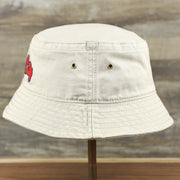 The wearer's left on the Red OCNJ Double Wordmark Navy Blue Outline Bucket Hat | Khaki Bucket Hat