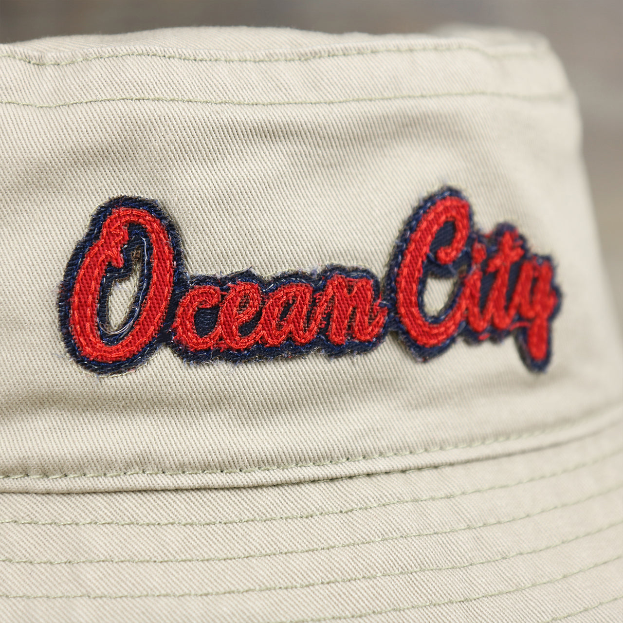 The Ocean City Wordmark on the Red OCNJ Double Wordmark Navy Blue Outline Bucket Hat | Khaki Bucket Hat