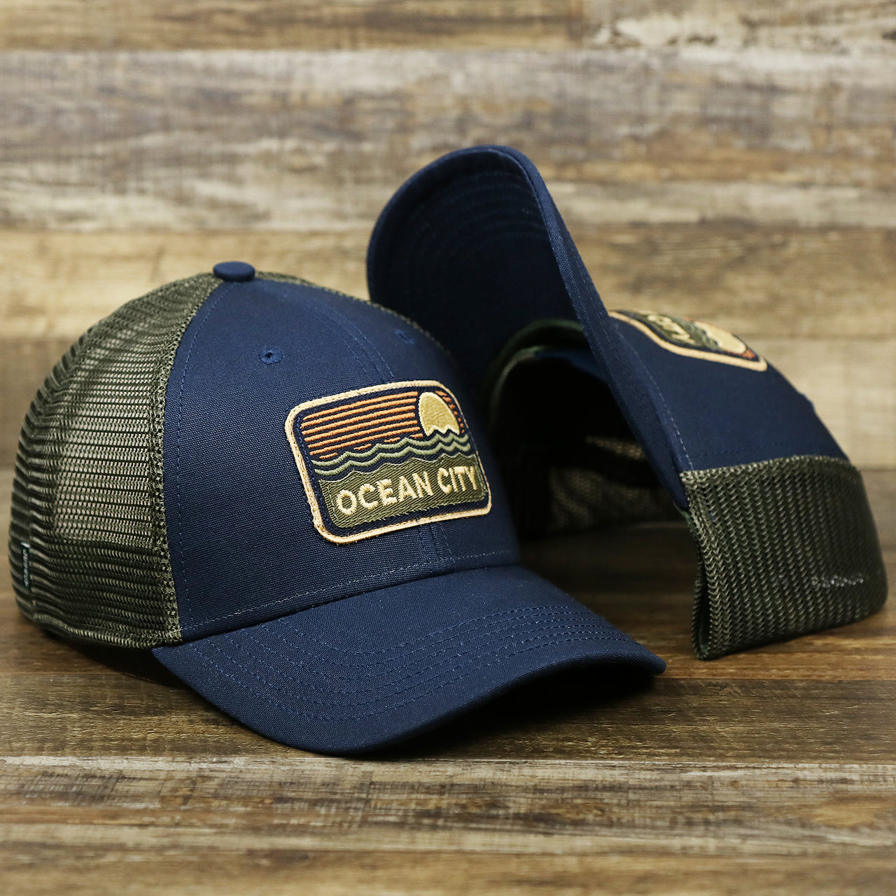 The New Jersey Ocean City Sunset Mesh Back Trucker Hat | Navy Blue And Olive Mesh Trucker Hat