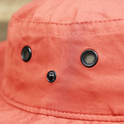The button on the New Jersey Ocean City Parallel Oars Cool Fit Boonie Hat | Nantucket Red Bucket Hat