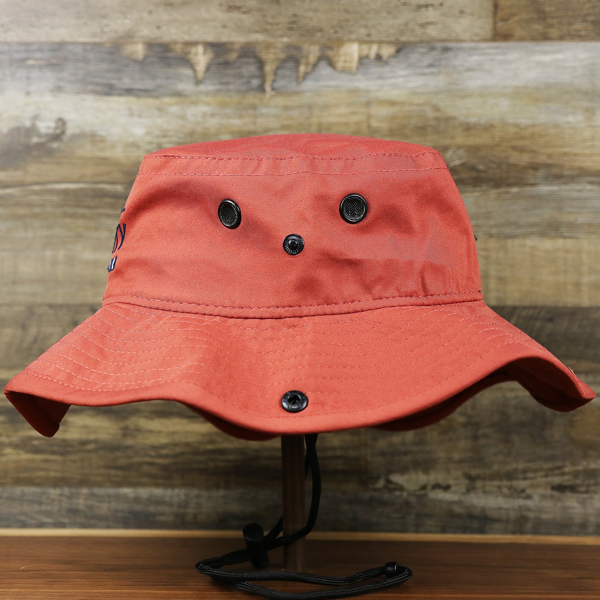 The wearer's left on the New Jersey Ocean City Parallel Oars Cool Fit Boonie Hat | Nantucket Red Bucket Hat