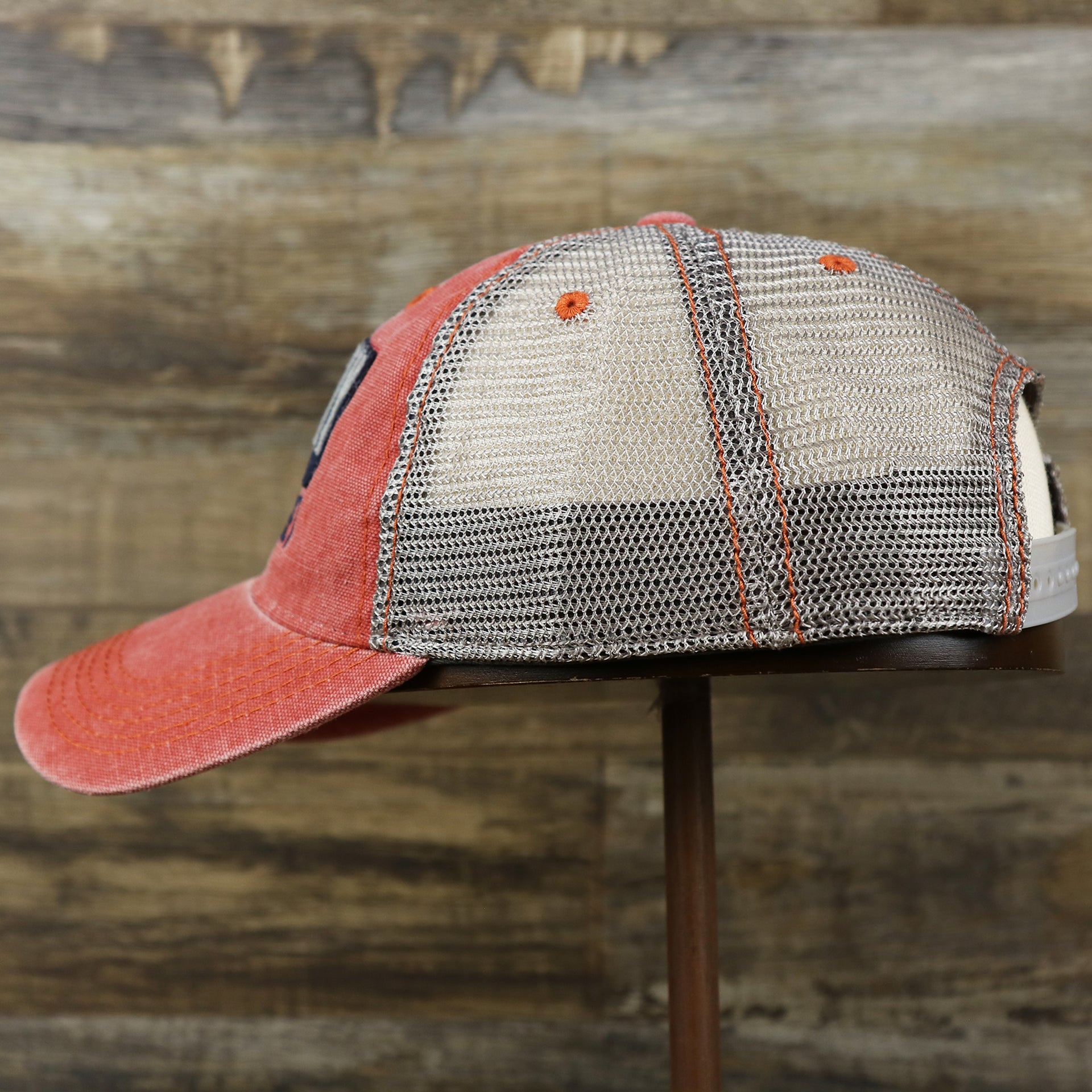 The wearer's left on the OCNJ Block Ocean City Wordmark Mesh Trucker Hat | Nantucket Red Trucker Hat