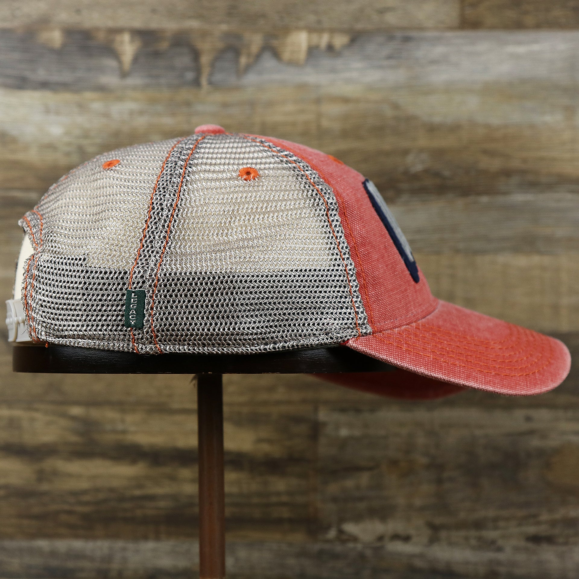 The wearer's right on the OCNJ Block Ocean City Wordmark Mesh Trucker Hat | Nantucket Red Trucker Hat