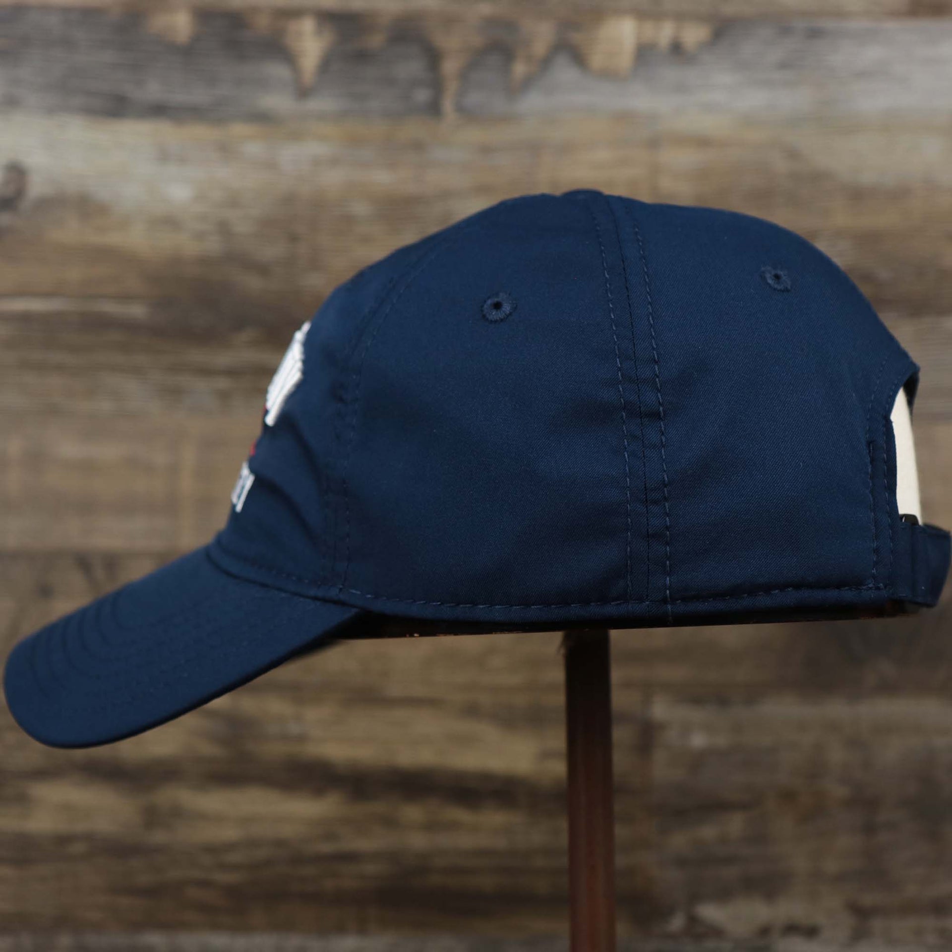 The wearer's left on the Ocean City New Jersey Wordmark Crossed Oars Logo Dad Hat | Navy Blue Dad Hat