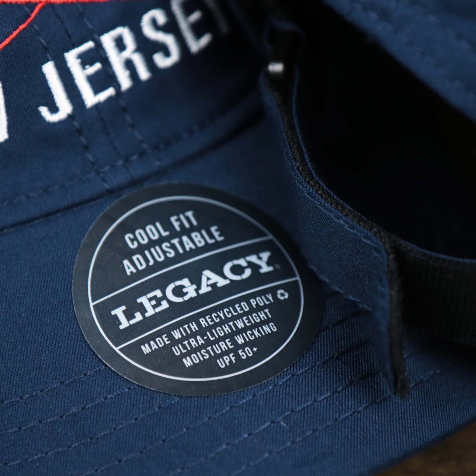 The League Legacy Sticker on the Ocean City New Jersey Wordmark Crossed Oars Logo Dad Hat | Navy Blue Dad Hat