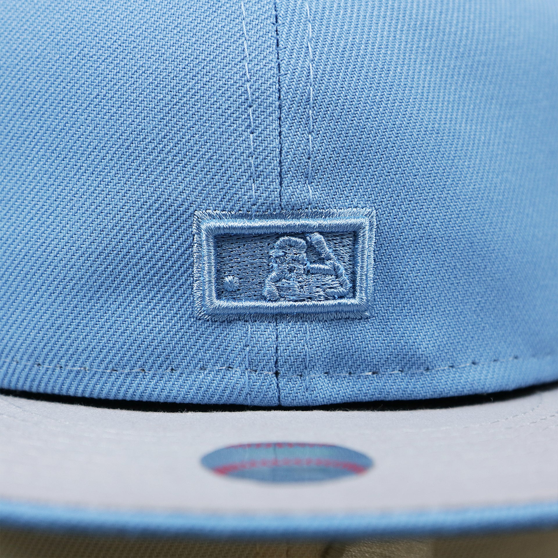 The MLB Batterman Logo on the Cooperstown Philadelphia Phillies Two Tone Tonal World Series Side Patch Fitted Cap With Gray Bottom | Columbia Blue and White Fitted Cap