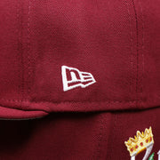 The New Era Logo on the Cooperstown Philadelphia Phillies Crown Champions Gray Bottom World Championship Wins Embroidered Fitted Cap | Maroon 59Fifty Cap
