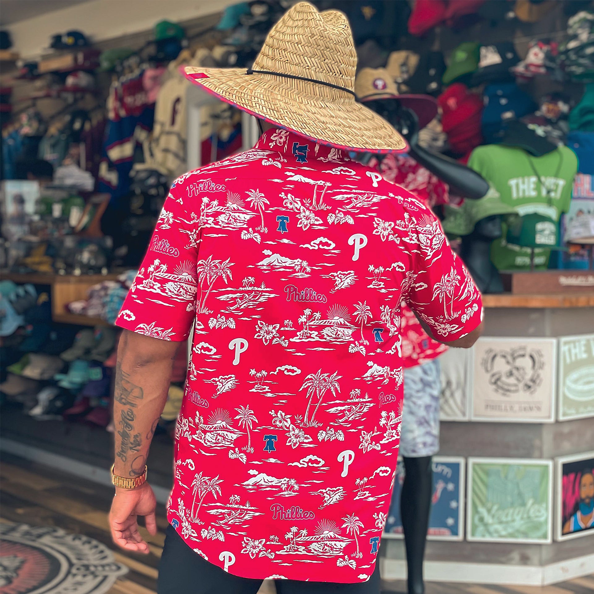 The backside of the Philadelphia Phillies Authentic Hawaiian Print Performance Polo Shirt | Red with matching Phillies Straw Hat