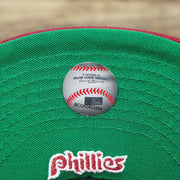 The MLB Baseball Sticker on the Cooperstown Philadelphia Phillies Wordmark Side Split Vintage Green Bottom With Phillies Embroidered Undervisor Fitted Cap | Maroon Blue 59Fifty Cap