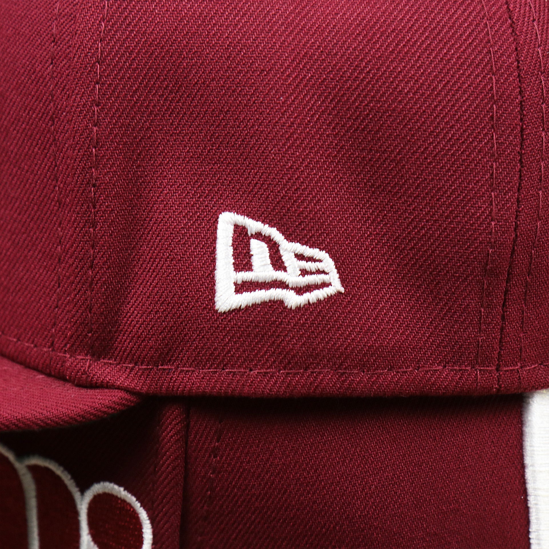 The New Era Logo on the Cooperstown Philadelphia Phillies Wordmark Side Split Vintage Green Bottom With Phillies Embroidered Undervisor Fitted Cap | Maroon Blue 59Fifty Cap