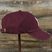 The wearer's right on the Cooperstown Philadelphia Phillies Vintage 1910s Phillies Logo Dad Hat | Dark Maroon Dad Hat