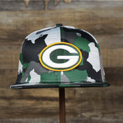 The front of the Green Bay Packers NFL OnField Summer Training 2022 Camo 9Fifty Snapback | Green Camo 9Fifty