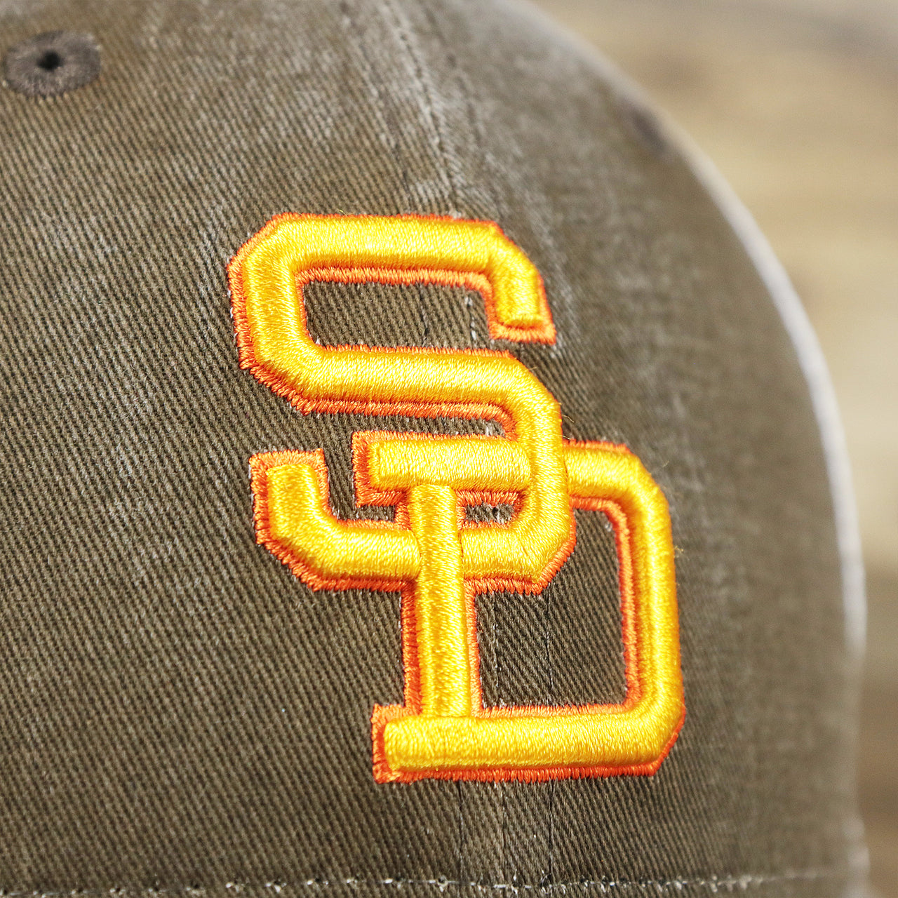 The Padres Logo on the Cooperstown San Diego Padres 1980s Logo Worn Colorway Mesh Back 9Forty Dad Hat | Brown 9Forty Hat