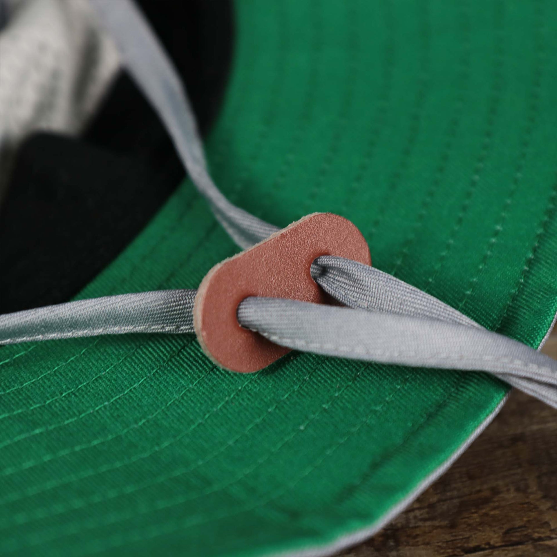 The chin strap on the Throwback Philadelphia Eagles Panama Pail Bucket Hat | 47 Brand, Gray