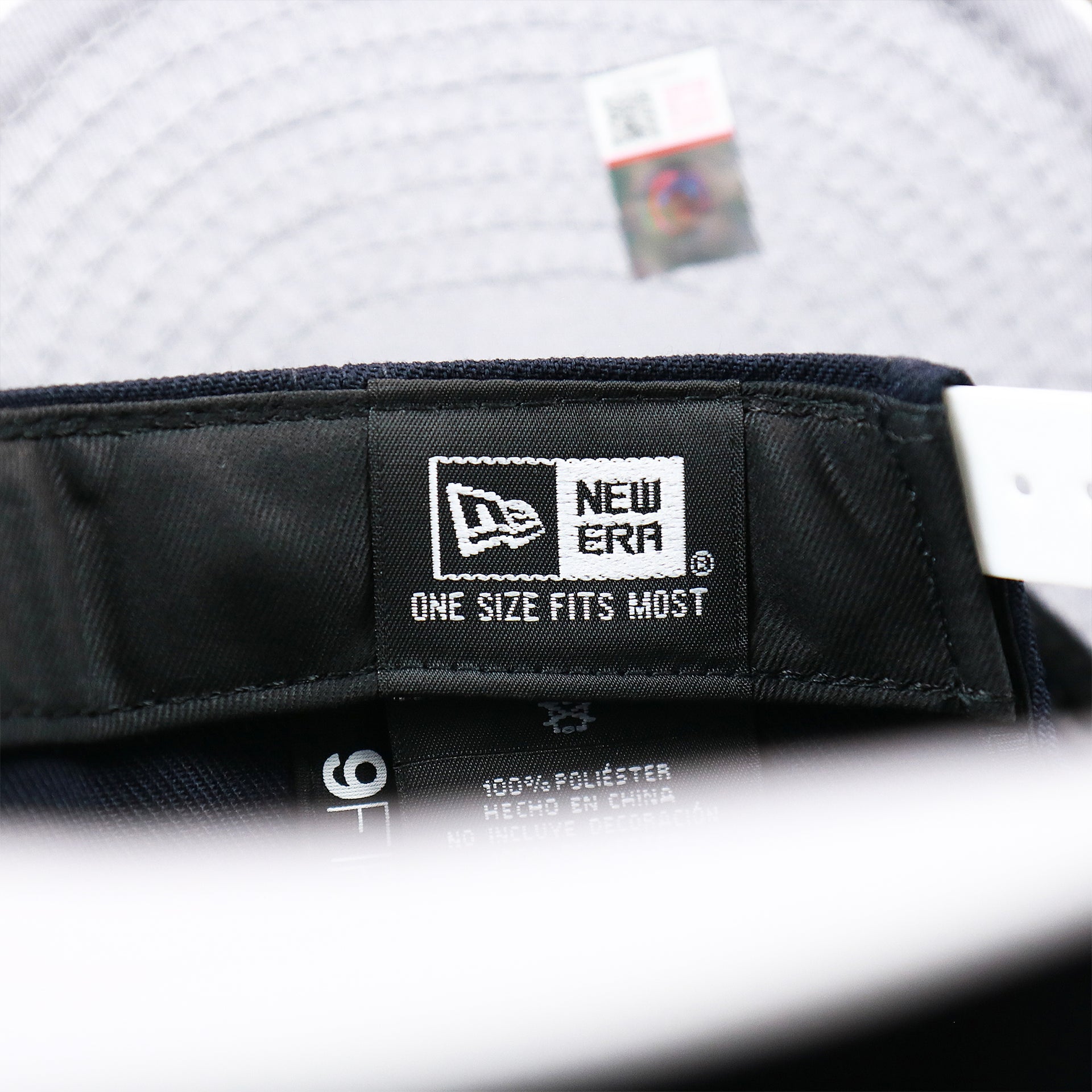 The New Era Tag on the Penn State Nittany Lions Team Script Gray Bottom 9Fifty Snapback | Navy Blue And White Snap Cap