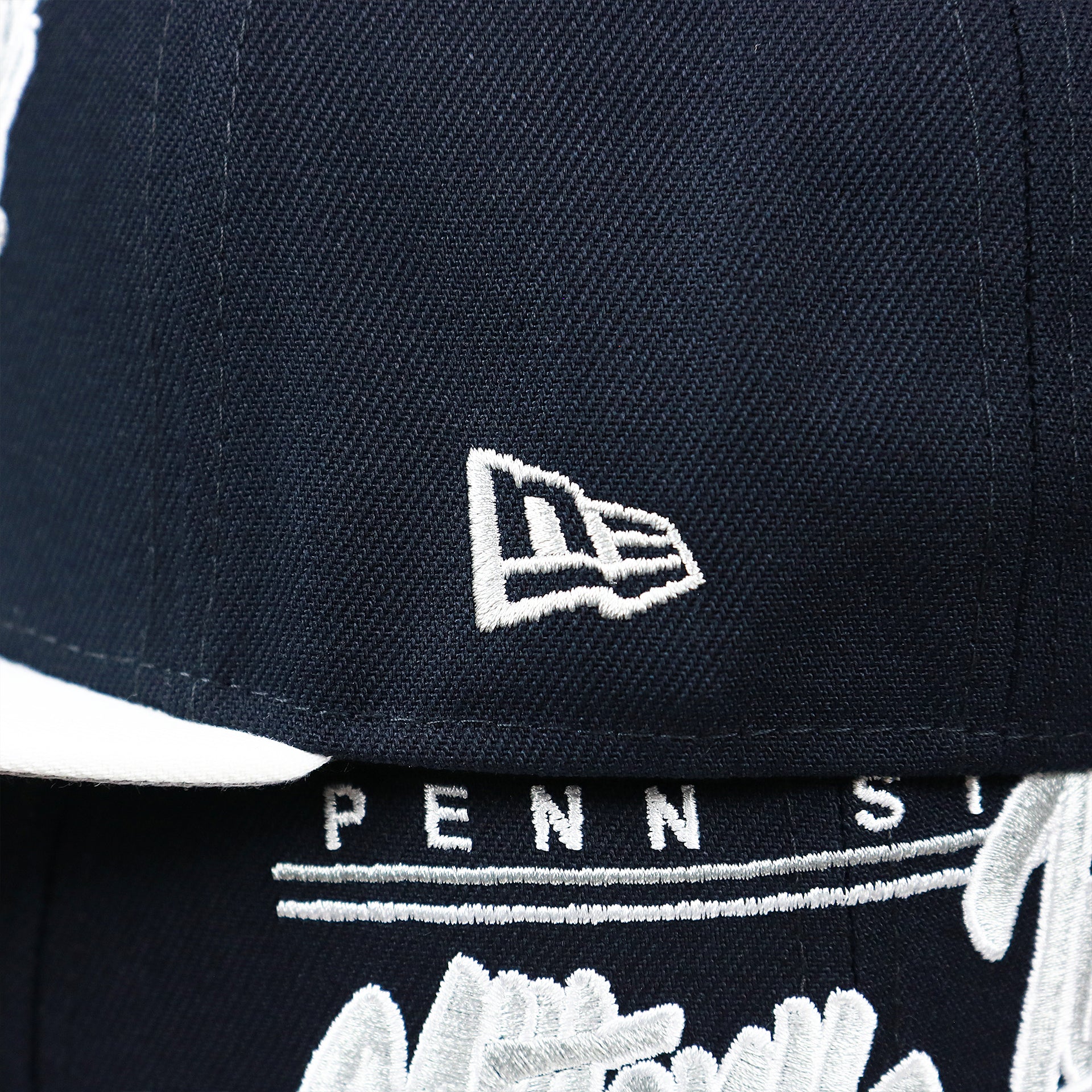 The New Era Logo on the Penn State Nittany Lions Team Script Gray Bottom 9Fifty Snapback | Navy Blue And White Snap Cap