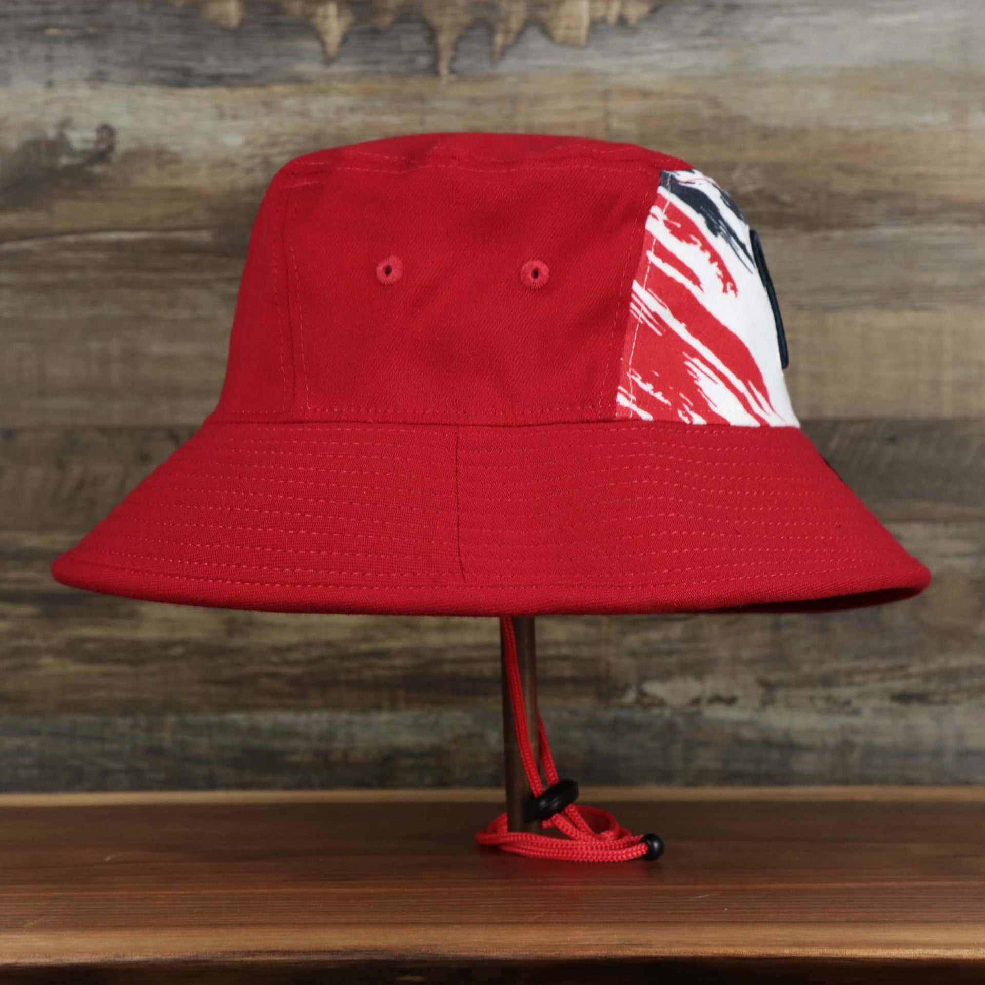 The wearer's right on the Stars And Stripes Philadelphia Phillies 4th of July Bucket Hat | New Era Red OSFM