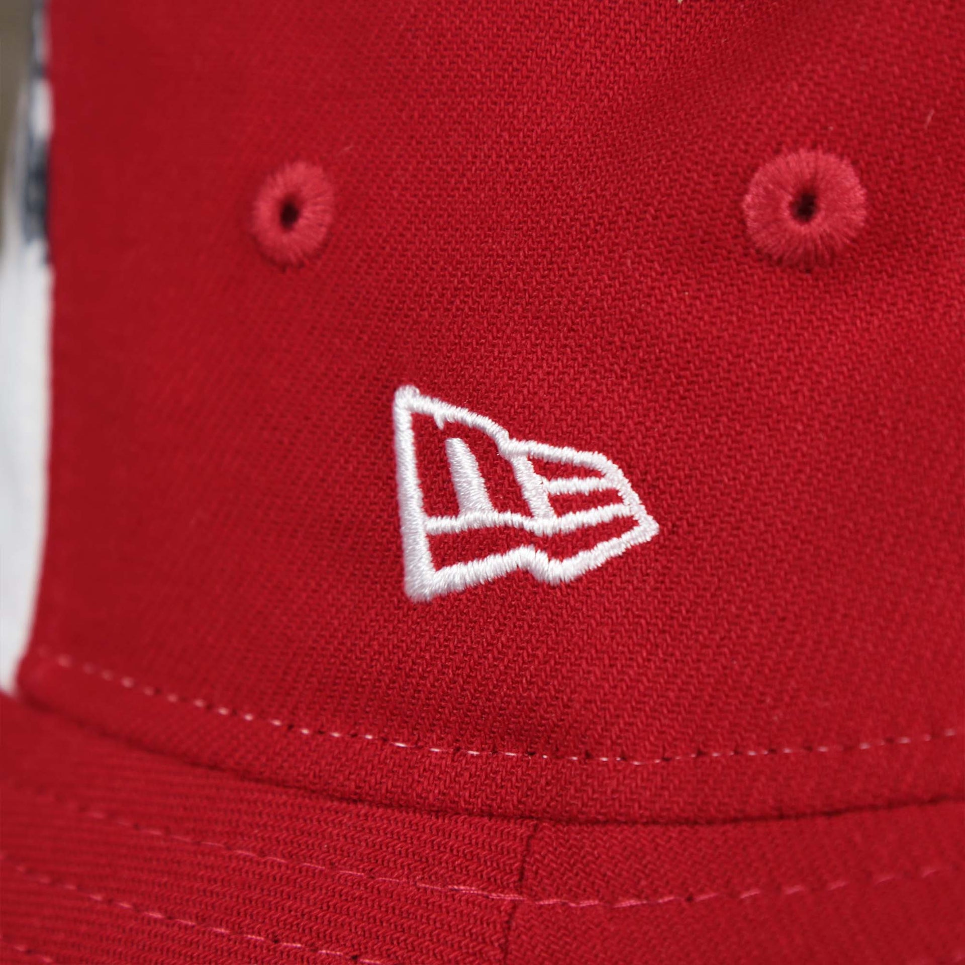 The New Era logo on the Stars And Stripes Philadelphia Phillies 4th of July Bucket Hat | New Era Red OSFM