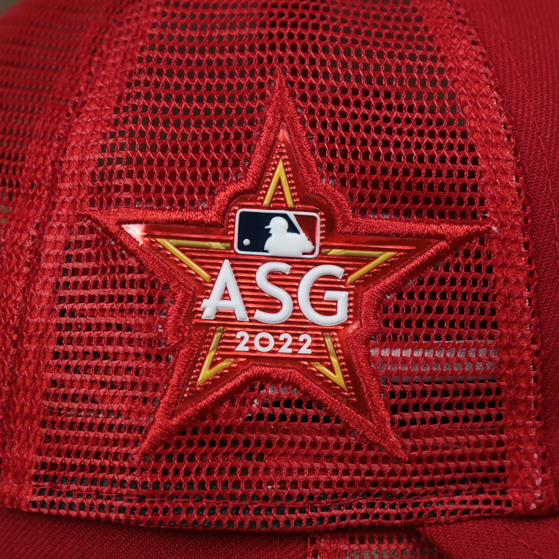 The ASG 2022 Side Patch on the Philadelphia Phillies Metallic All Star Game MLB 2022 Side Patch 9Forty Mesh Trucker | ASG 2022 Red Trucker Hat