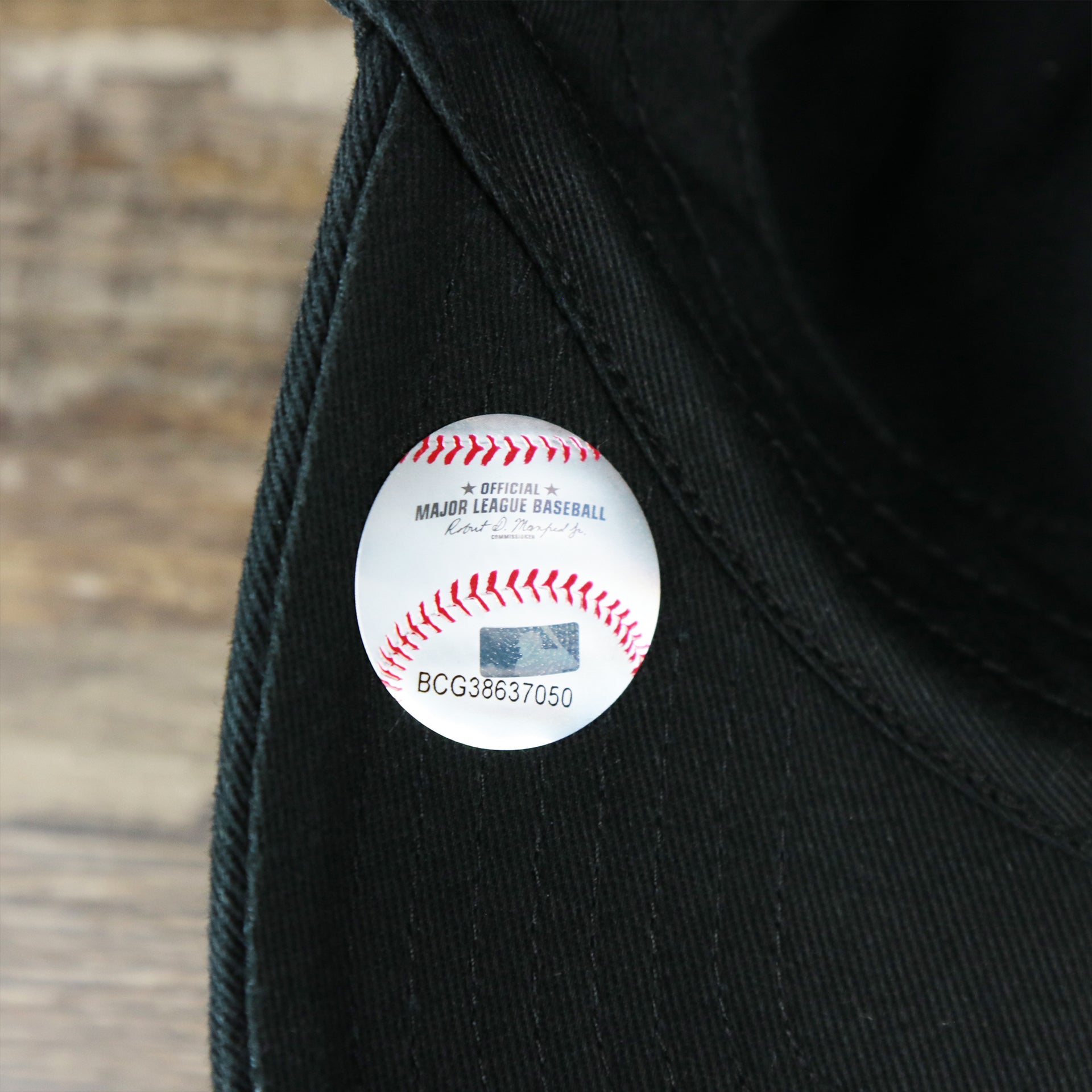 The MLB Baseball Sticker on the Cooperstown Philadelphia Phillies Vintage White Logo Dad Hat | Black Dad Hat