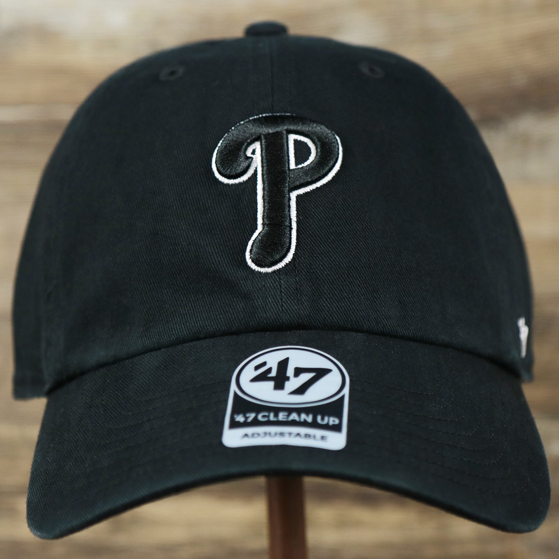 The front of the Cooperstown Philadelphia Phillies Vintage White Logo Dad Hat | Black Dad Hat