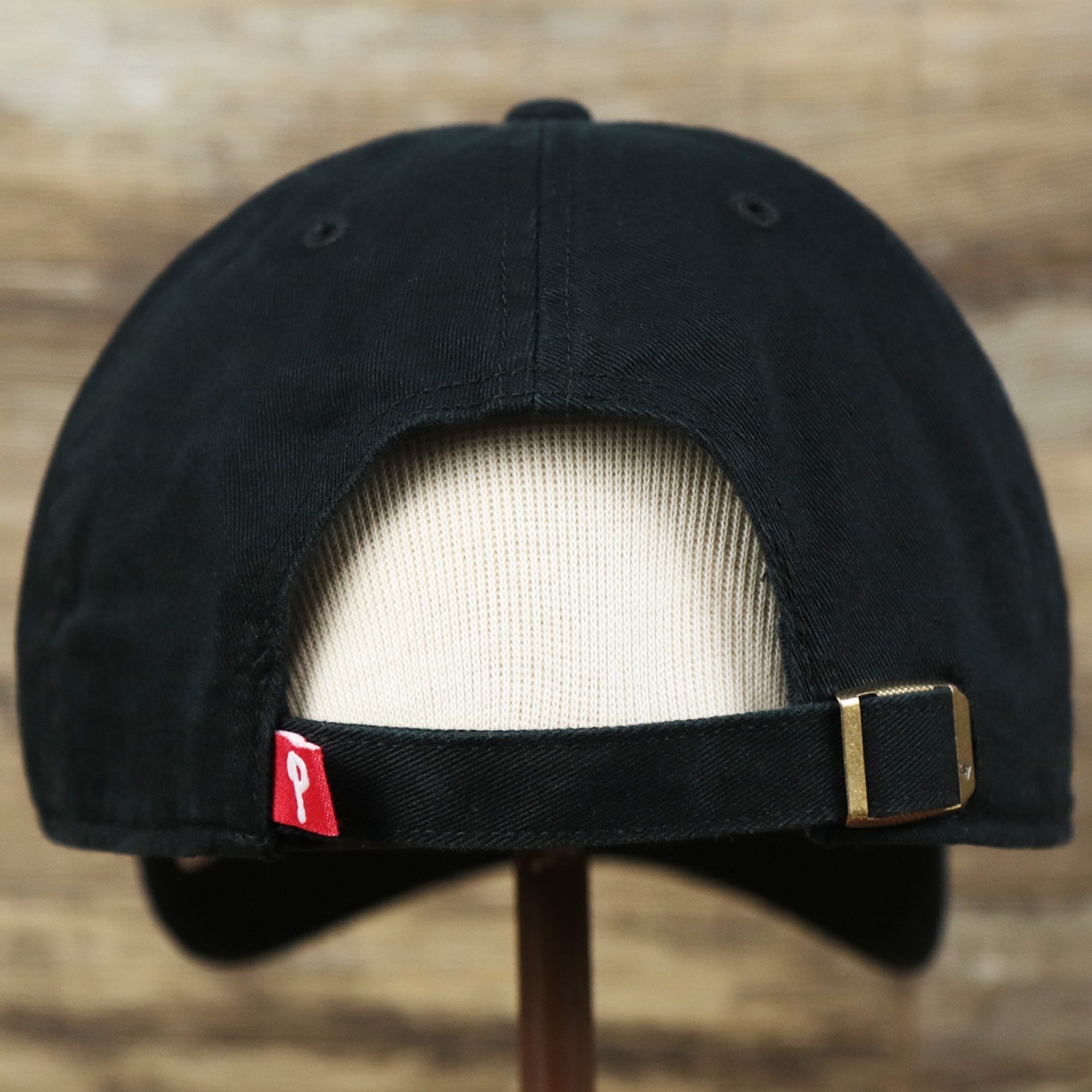 The backside of the Cooperstown Philadelphia Phillies Vintage White Logo Dad Hat | Black Dad Hat