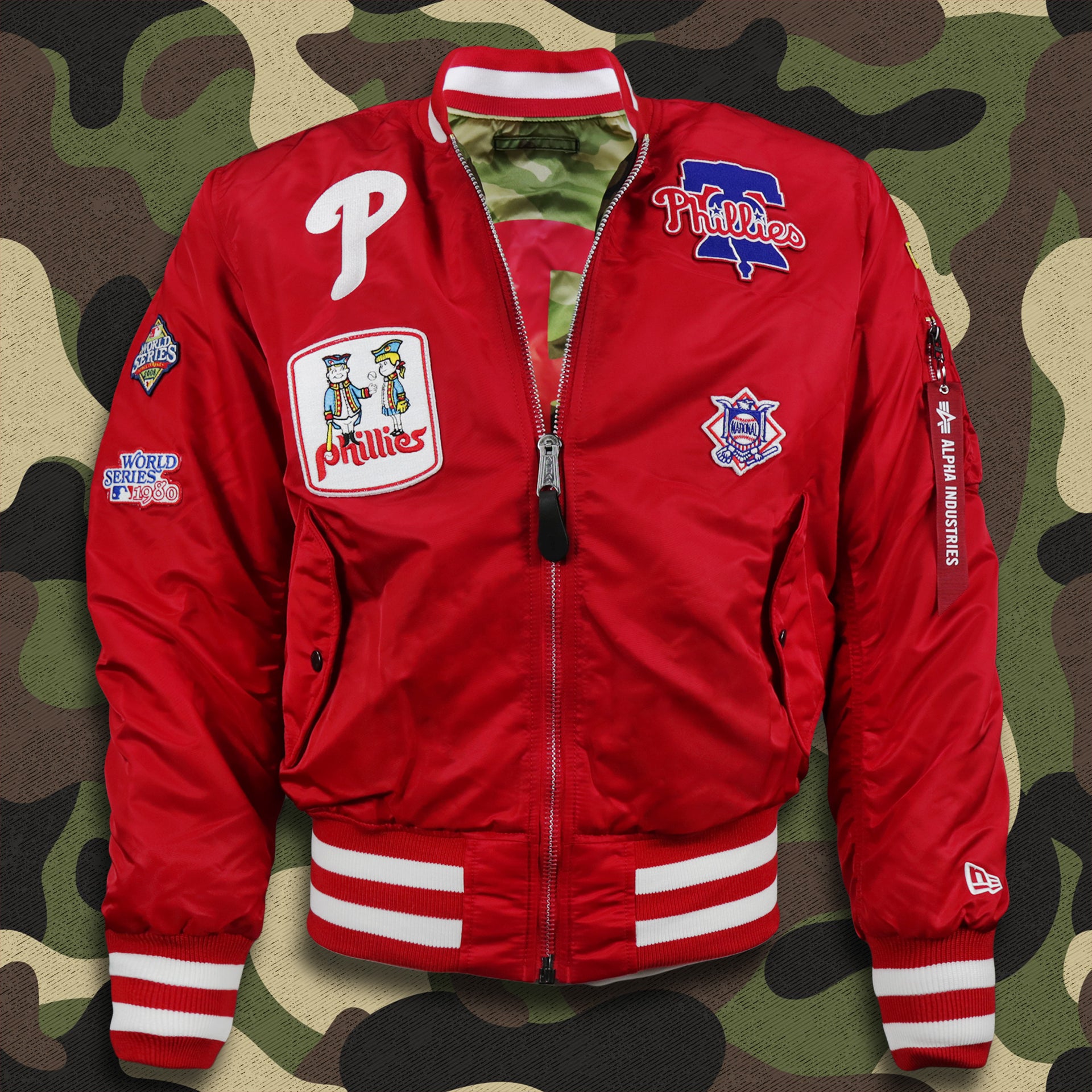The front of the Philadelphia Phillies MLB Patch Alpha Industries Reversible Bomber Jacket With Camo Liner | Red Bomber Jacket