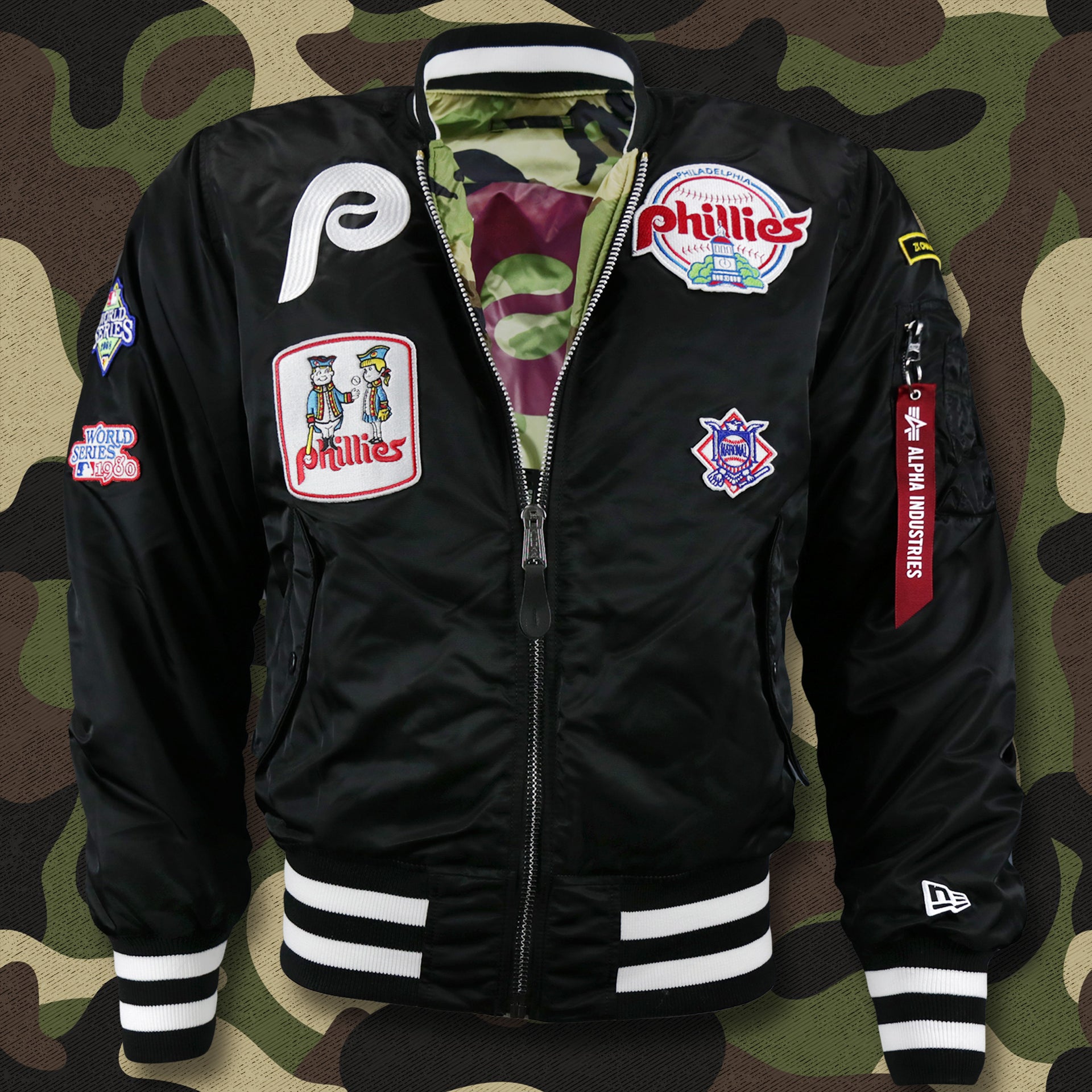The front of the Cooperstown Philadelphia Phillies MLB Patch Alpha Industries Reversible Bomber Jacket With Camo Liner | Black Bomber Jacket