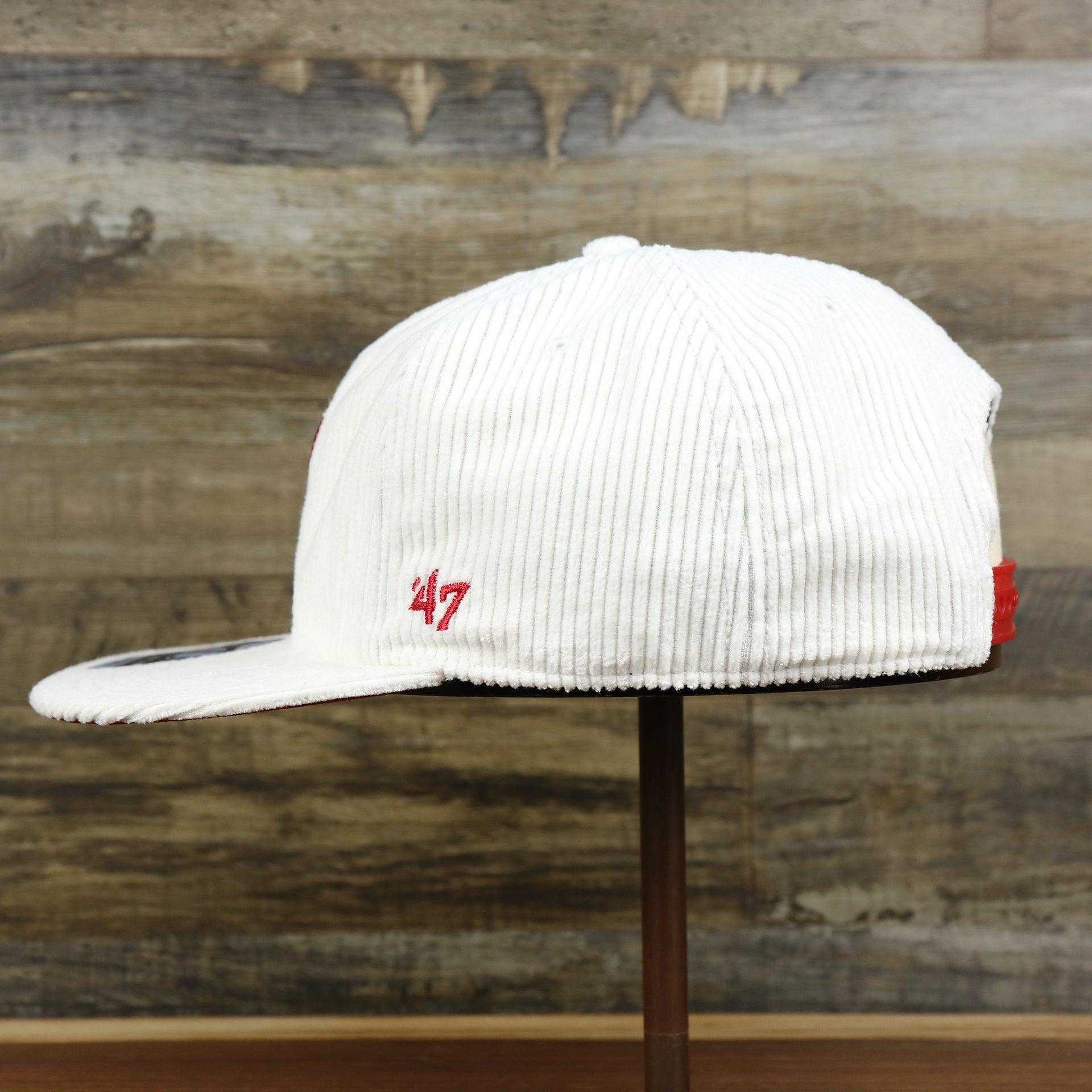 The wearer's left of the Philadelphia Phillies Corduroy Snapback Hat | White Corduroy Snap Cap