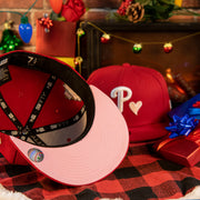 pink under visor on the Philadelphia Phillies 2008 World Series Pink Heart Patch 59fifty Pink Brim Fitted Hat | Red