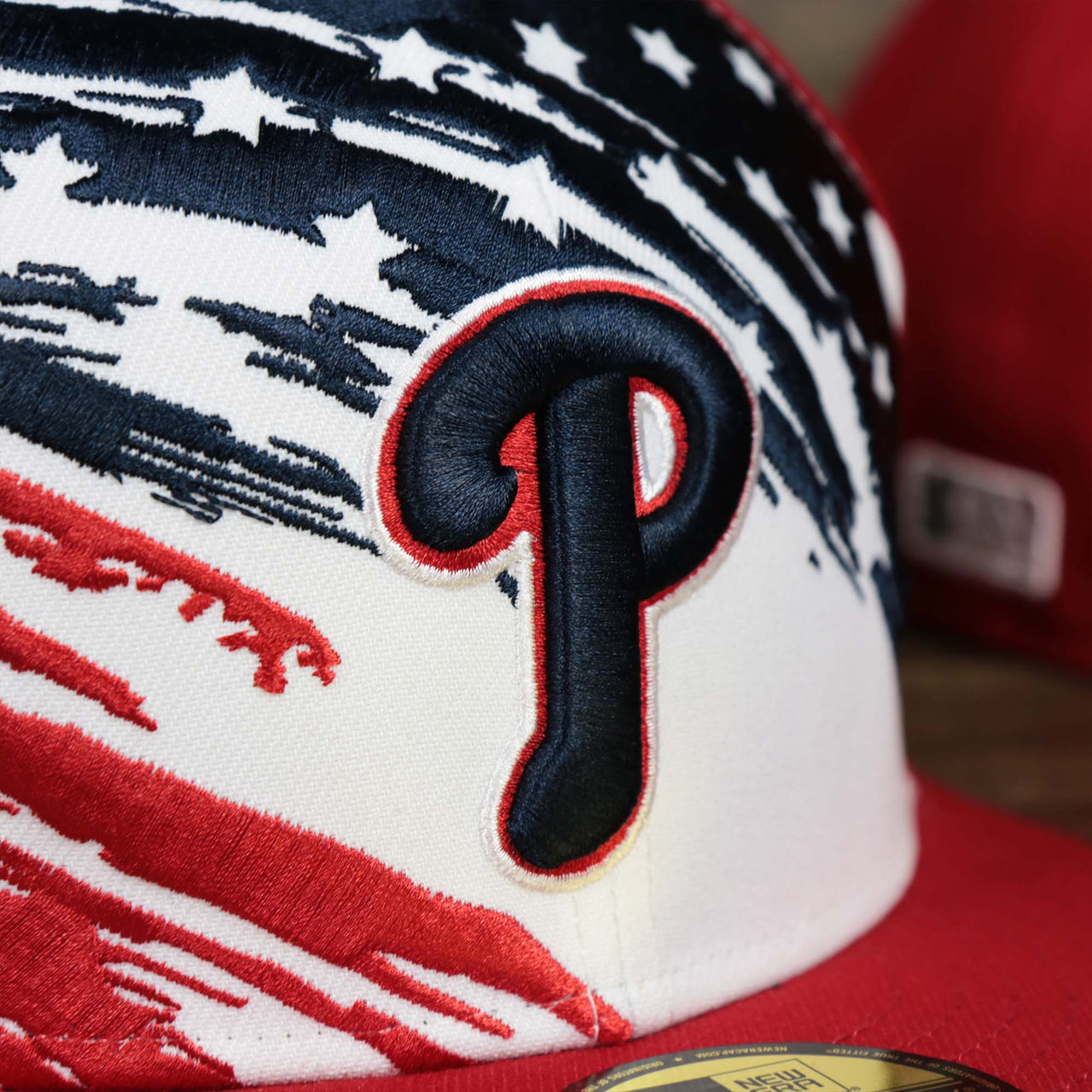 The Phillies logo on the Stars And Stripes Philadelphia Phillies 4th of July 59Fifty | New Era Red OSFM