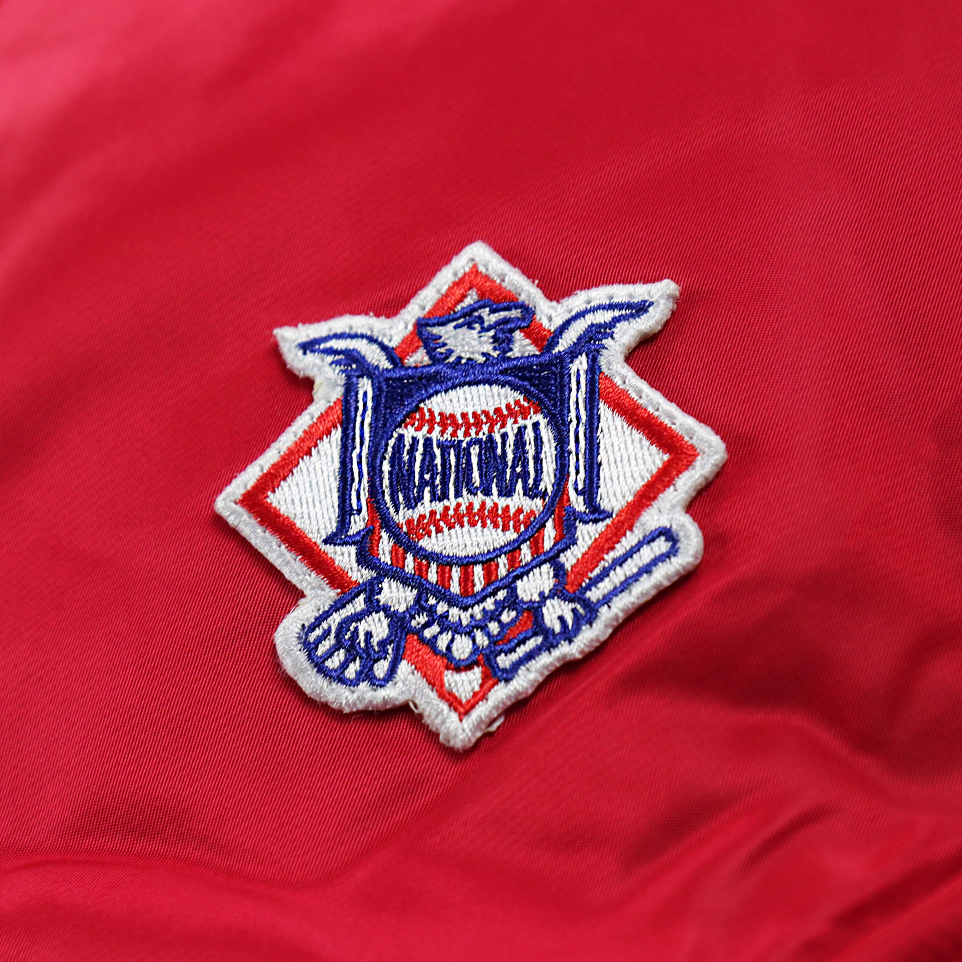 The National Baseball League Side Patch on the Philadelphia Phillies MLB Patch Alpha Industries Reversible Bomber Jacket With Camo Liner | Red Bomber Jacket