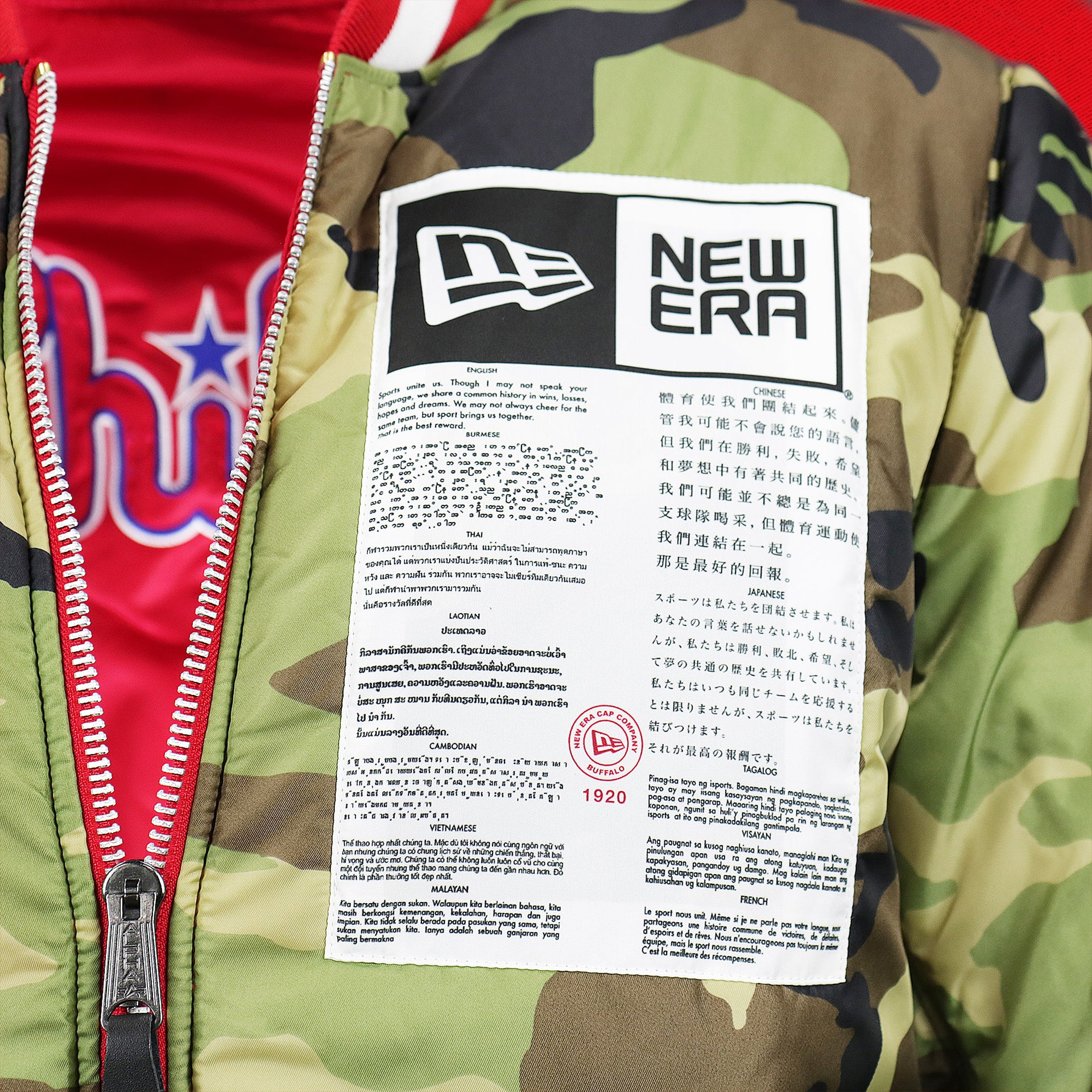 The New Era Sports Unite Us Graphic on the Philadelphia Phillies MLB Patch Alpha Industries Reversible Bomber Jacket With Camo Liner | Red Bomber Jacket